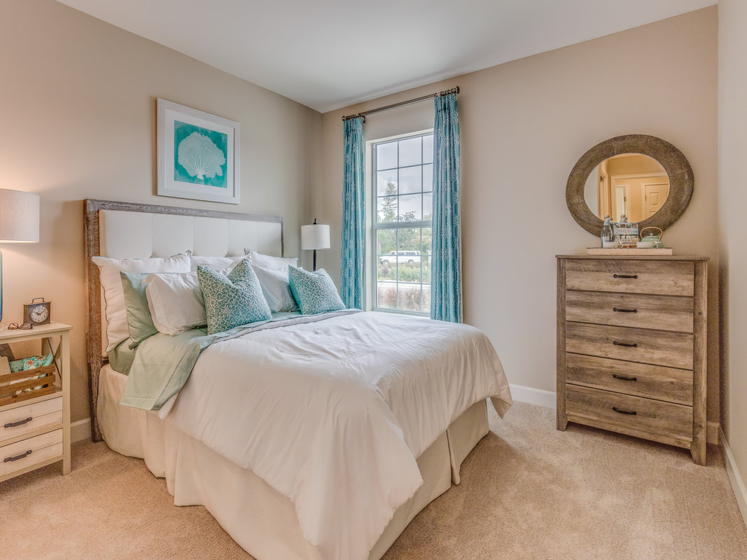 A clutter-free, organized bedroom emphasizes that you can support your goals when you learn where to start decluttering your home. 
