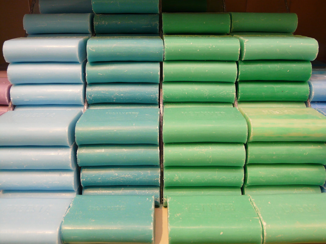 Color-coordinated stacks of handmade soap are an example or creating order.Picture